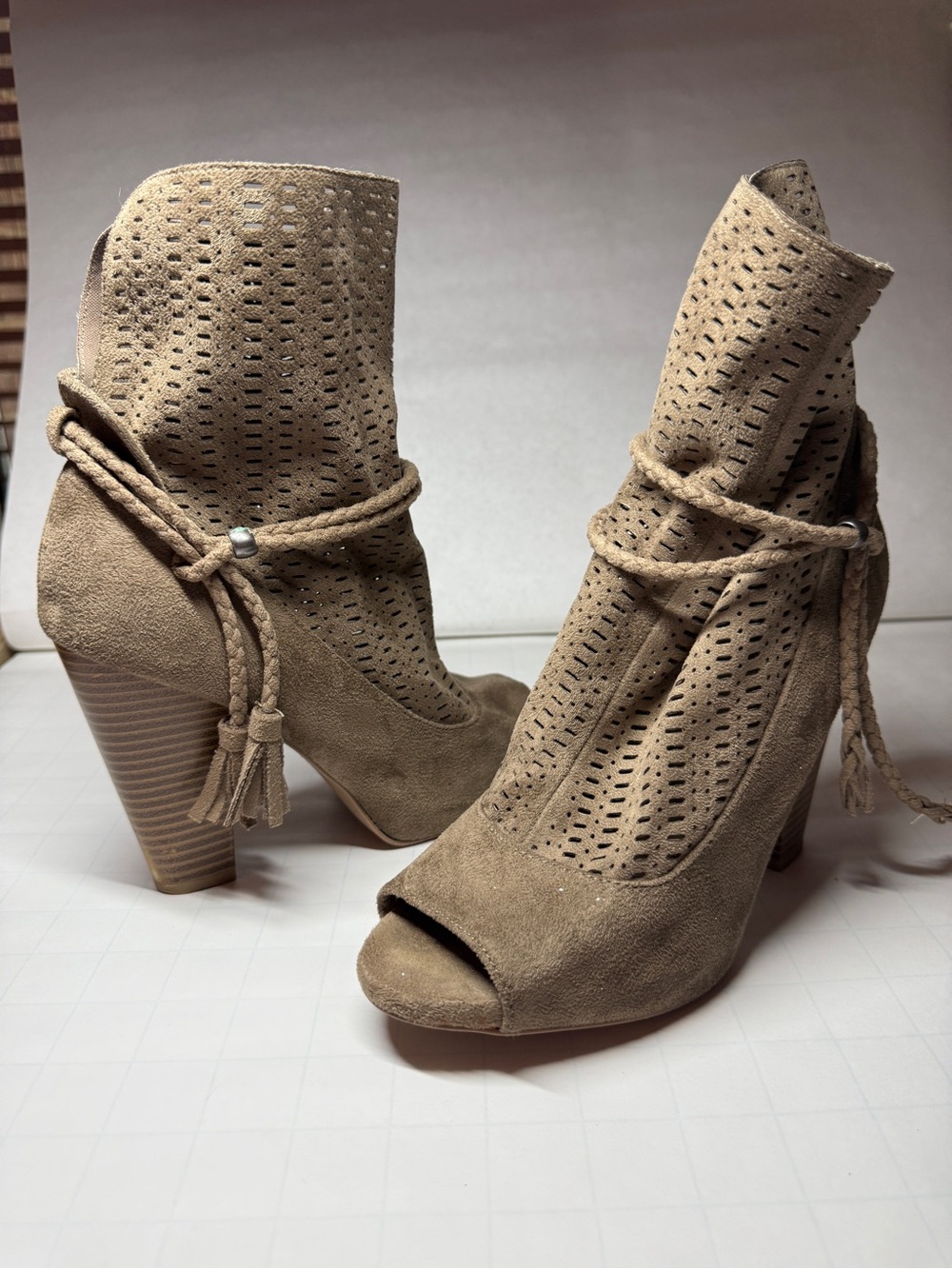 Suede Peep-Toe Perforated Ankle Booties in Taupe